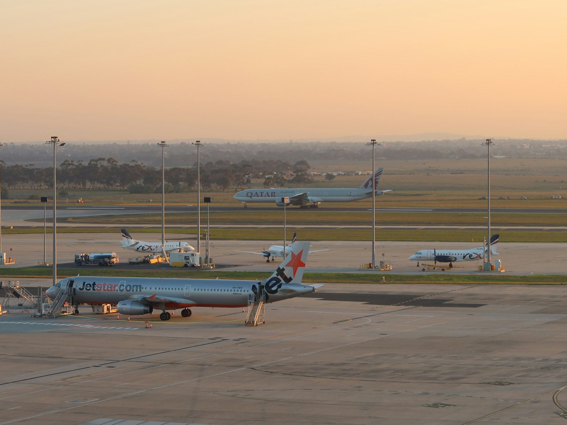 Airport tarmac at sunset representing travel enterprise operations on the Decision Execution Layer.